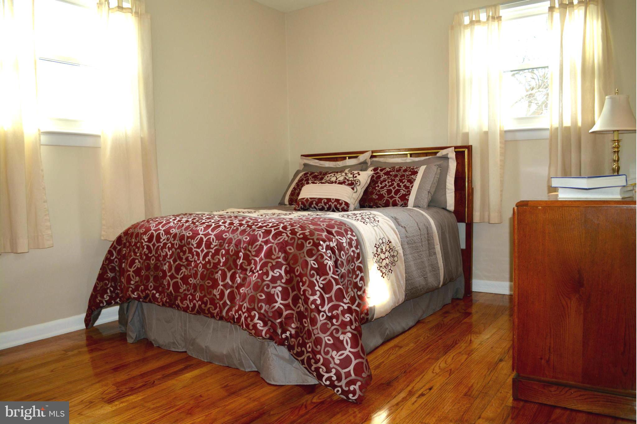 2208 Snow Road Edgewood, MD 21040 - Photo 8 of 23 a large bed sitting in a bedroom next to a window