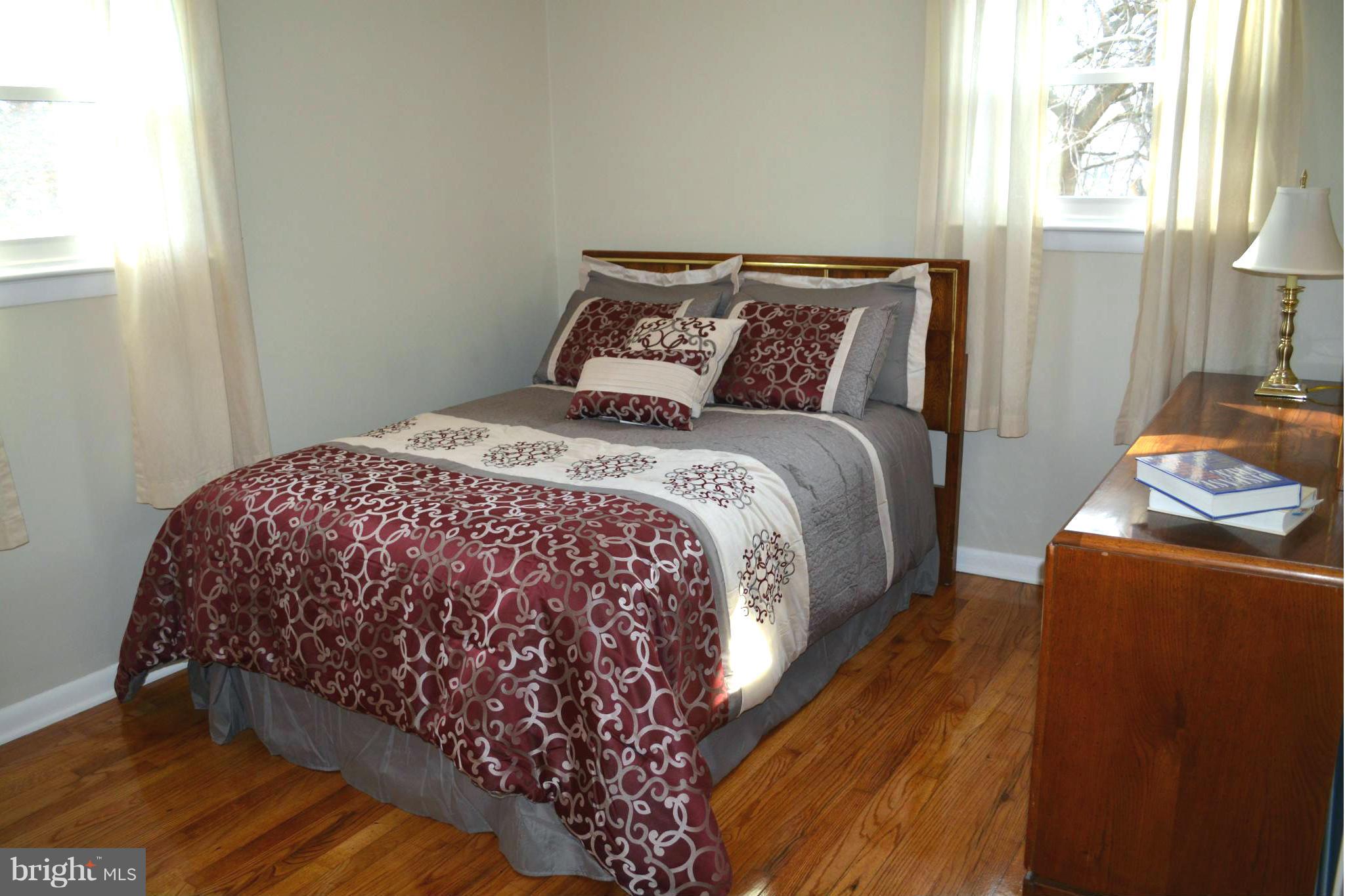 2208 Snow Road Edgewood, MD 21040 - Photo 9 of 23 a bed sitting in a bedroom next to a window
