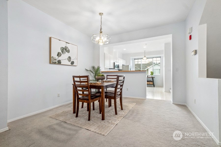 2300 Benson Road South, Unit C 3 Renton, WA 98055 - Photo 6 of 26 a view of a dining room that has a table and chairs
