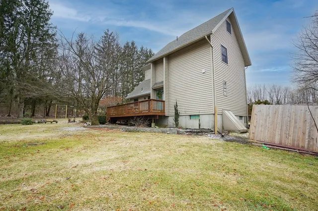 a house that has a tree in front of it