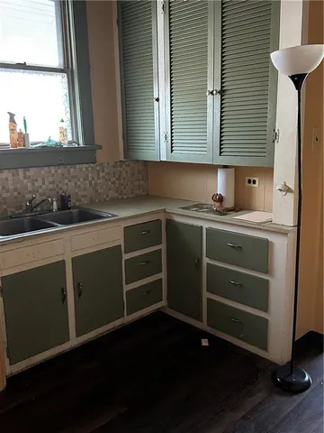 a kitchen with a sink and cabinets