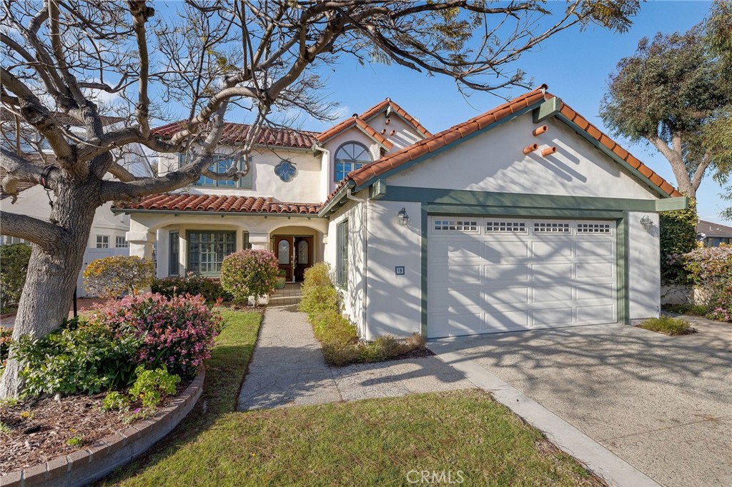 19 Village Circle Manhattan Beach, CA 90266 - Photo 1 of 26 a view of a house with large windows and a tree