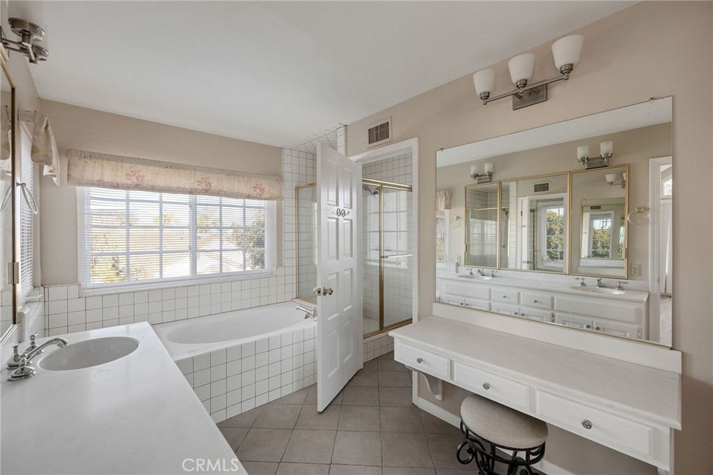 19 Village Circle Manhattan Beach, CA 90266 - Photo 18 of 26 a spacious bathroom with sink shower bathtub and next to a window