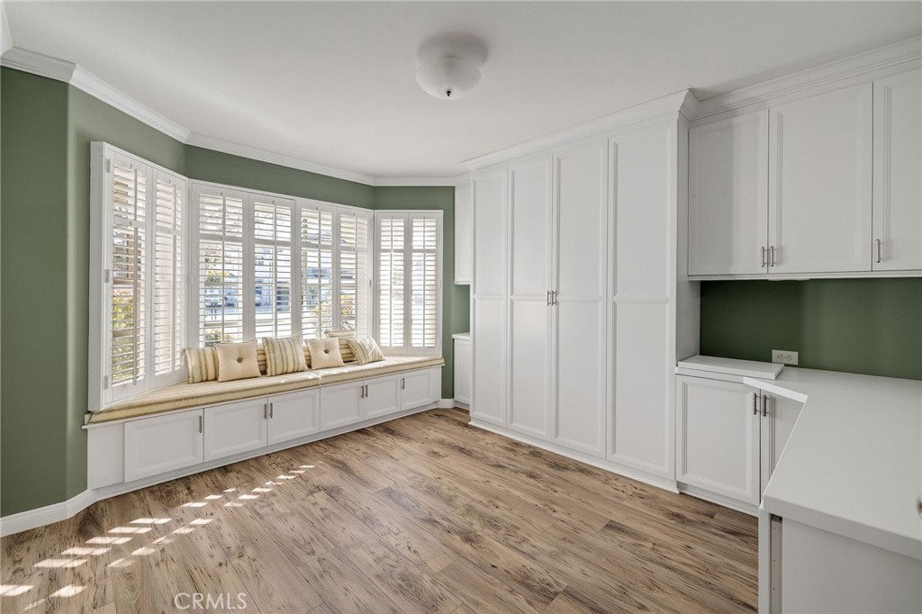 19 Village Circle Manhattan Beach, CA 90266 - Photo 25 of 26 a view of an empty room with a window and wooden floor