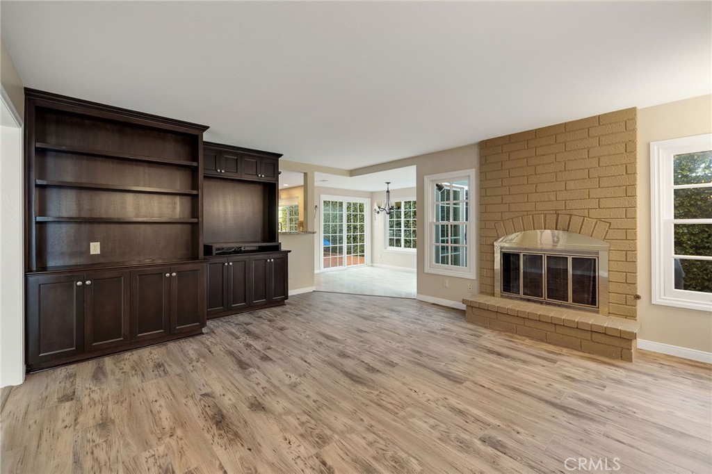 19 Village Circle Manhattan Beach, CA 90266 - Photo 4 of 26 a living room with a flat screen tv and a fireplace