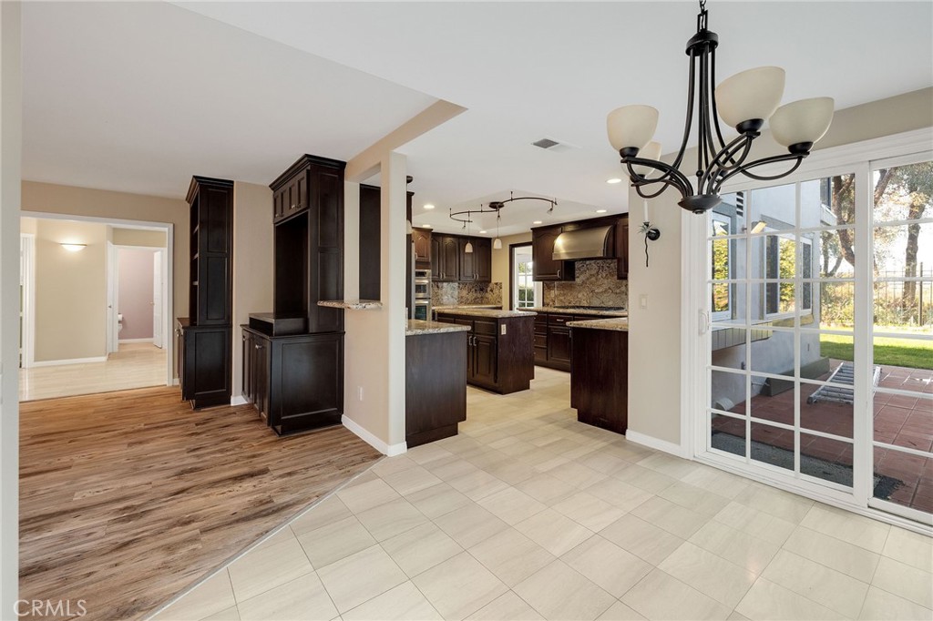 19 Village Circle Manhattan Beach, CA 90266 - Photo 5 of 26 a kitchen view with stainless steel appliances kitchen island granite countertop a refrigerator and a sink