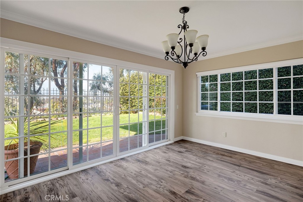 19 Village Circle Manhattan Beach, CA 90266 - Photo 8 of 26 a view of a room with wooden floor and windows