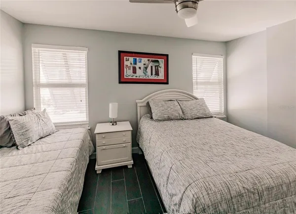 a bedroom with a large bed and a couch