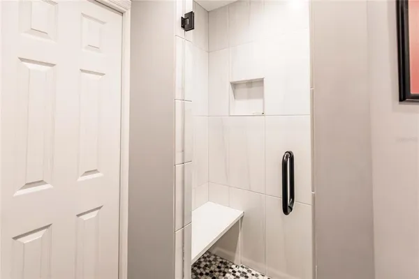 a bathroom with a shower and toilet