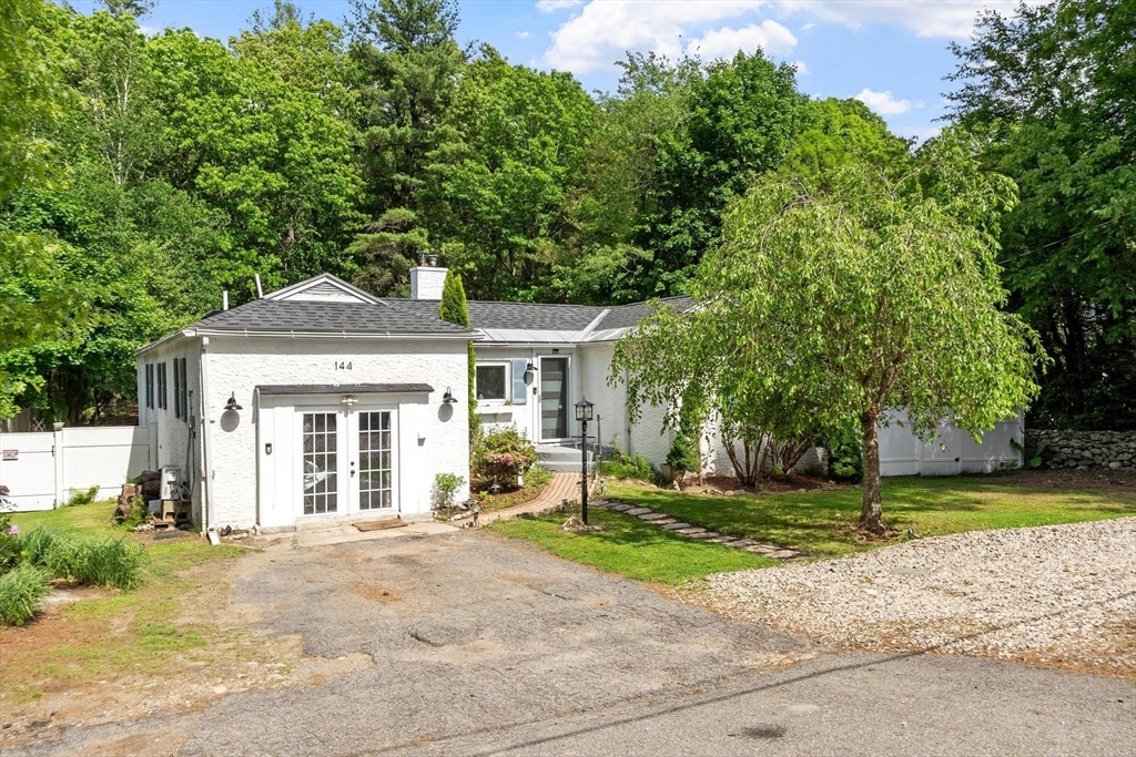 144 Bailey Road Holden, MA 01520 - Photo 1 of 42 a front view of a house with a yard and garage