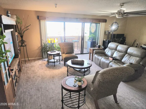 a living room with furniture and a large window