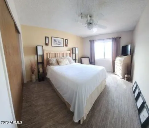 a bedroom with a bed and window