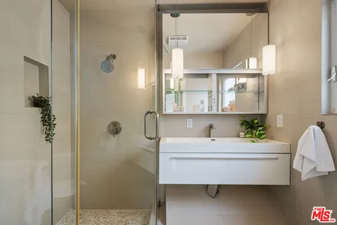 a bathroom with a sink and a mirror