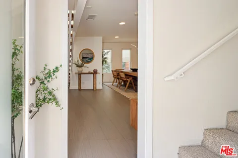 a view of a livingroom with furniture and front door