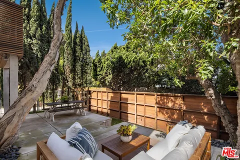 a view of balcony with couch and potted plants