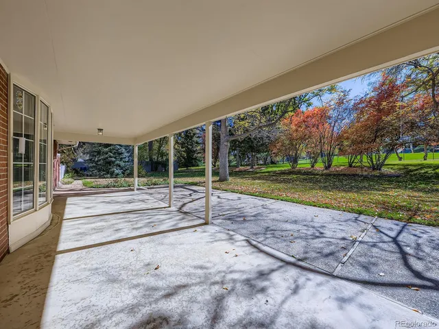 a view of an empty room with a fireplace