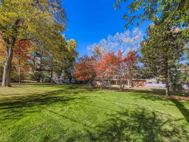 a backyard of a house with lots of green space and outdoor space