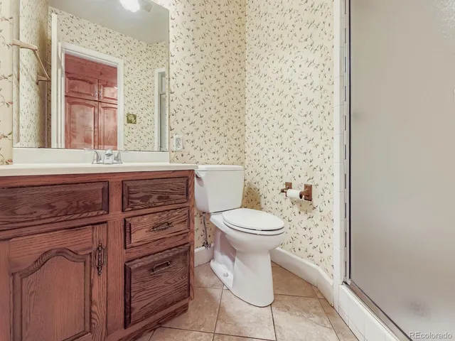 a kitchen with a stove a sink and a refrigerator