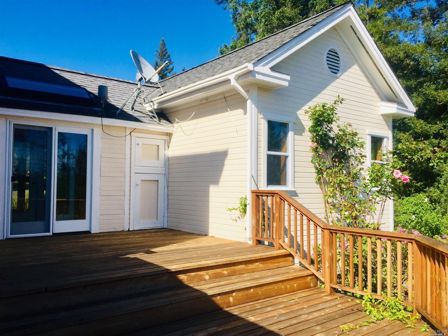 7 3 Point Road Annapolis, CA 95412 - Photo 1 of 1 a front view of a house with a porch