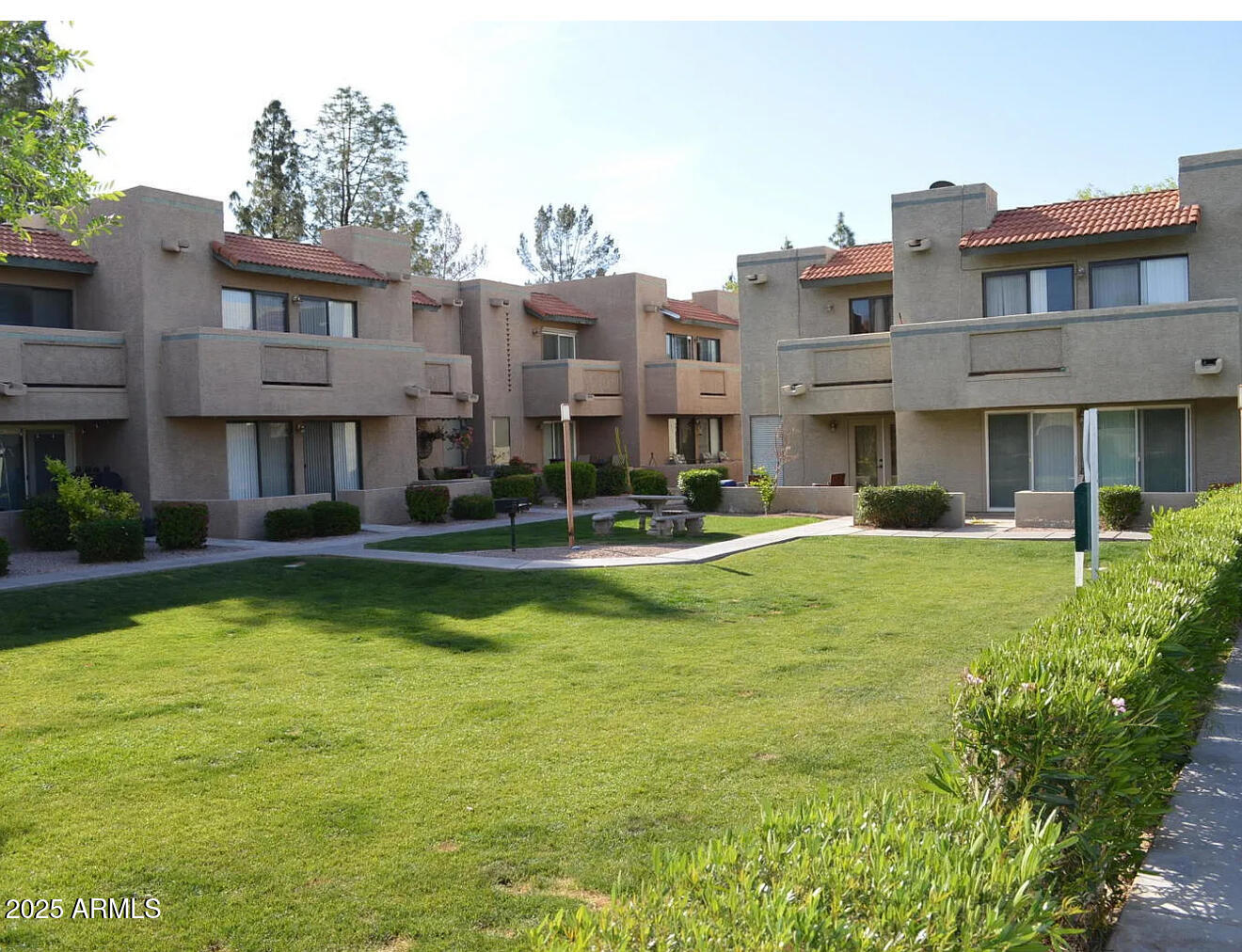 a view of building with swimming pool and outdoor space