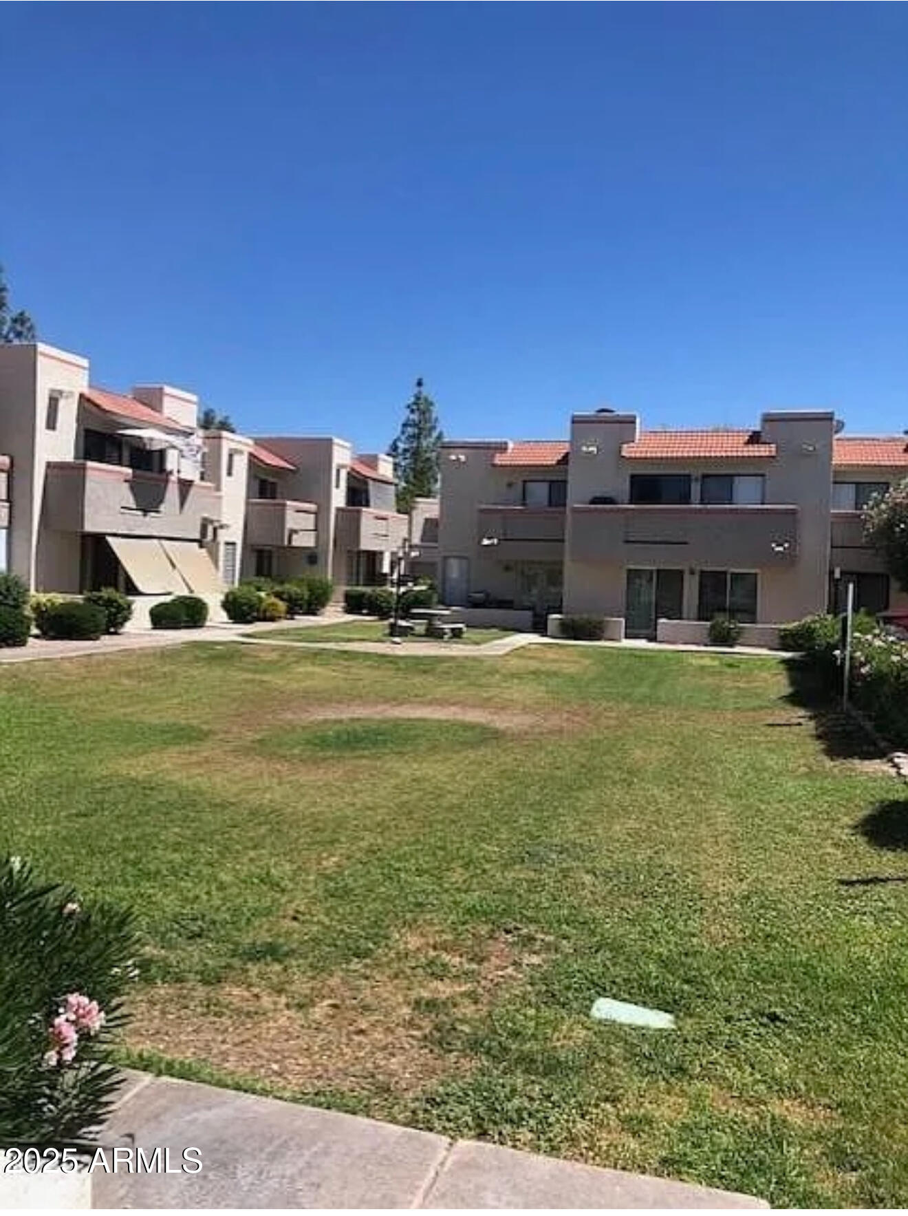 985 North Granite Reef Road, Unit 156 Scottsdale, AZ 85257 - Photo 15 of 17 a view of a house with a yard