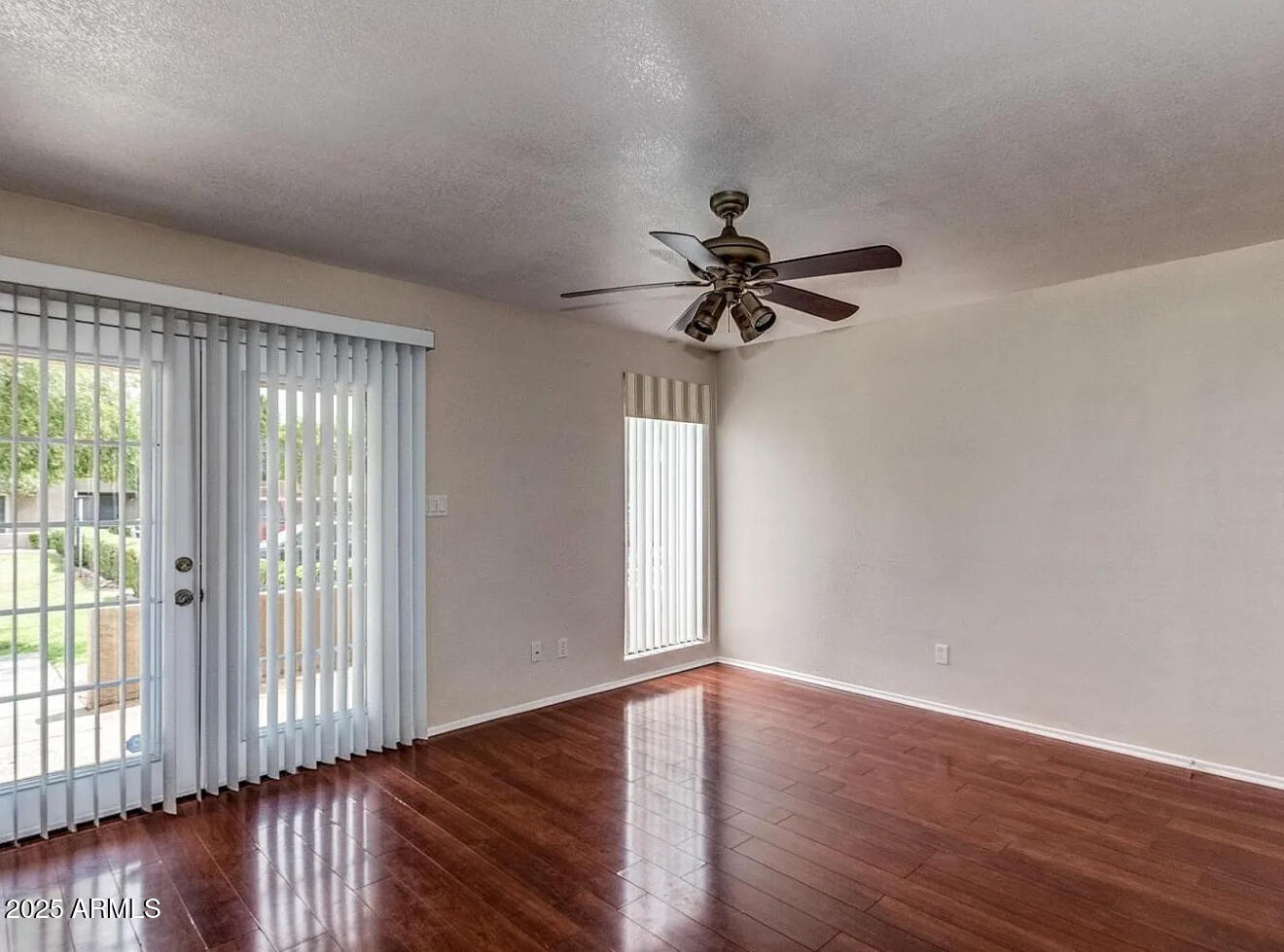985 North Granite Reef Road, Unit 156 Scottsdale, AZ 85257 - Photo 2 of 17 wooden floor in an empty room with a window
