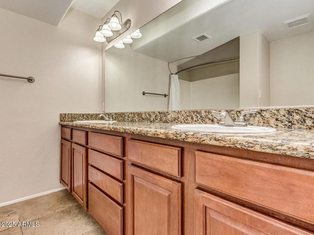 985 North Granite Reef Road, Unit 156 Scottsdale, AZ 85257 - Photo 7 of 17 a bathroom with a granite countertop sink and a mirror