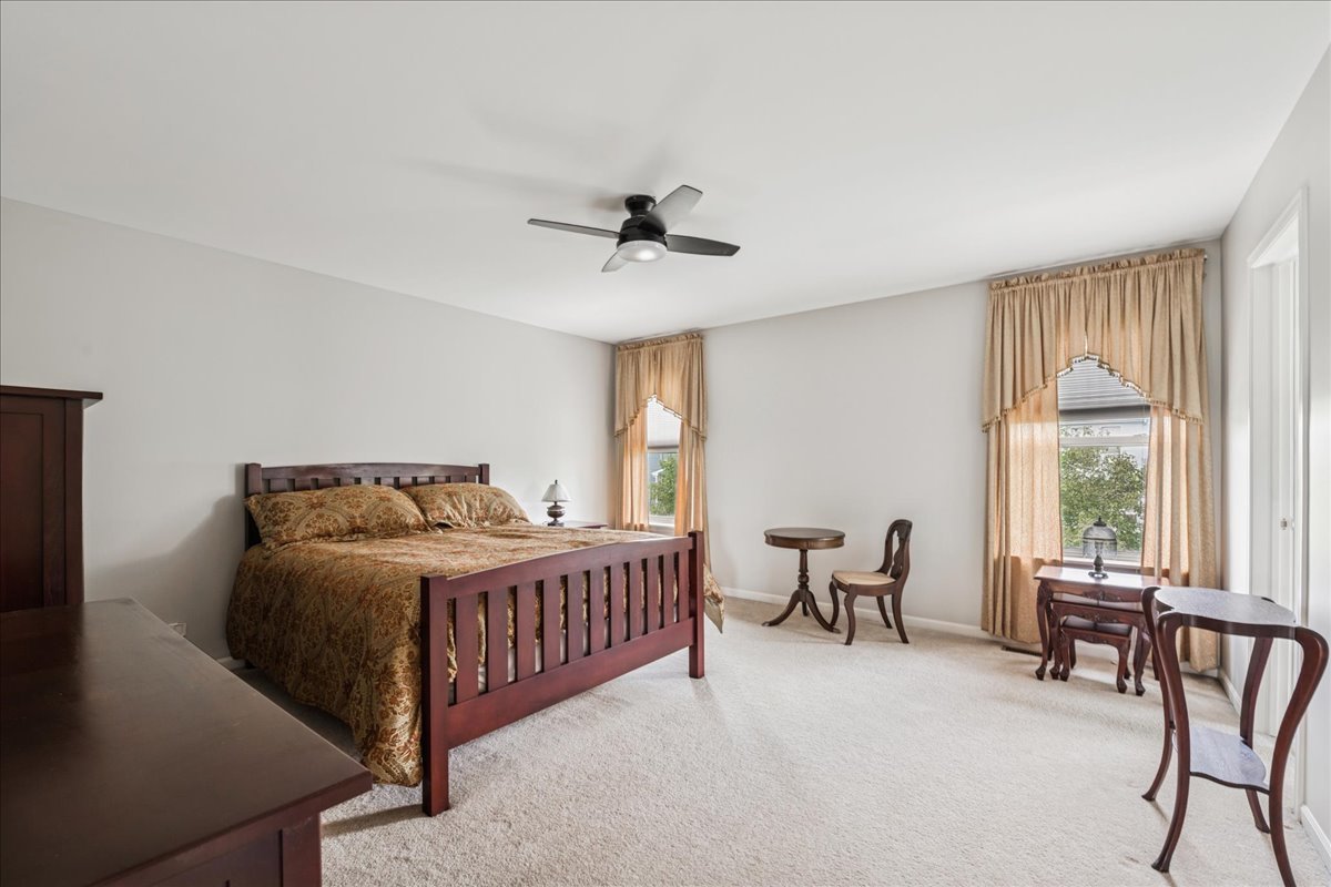 311 Market Street Genoa, IL 60135 - Photo 12 of 24 a bedroom with a bed and a large window