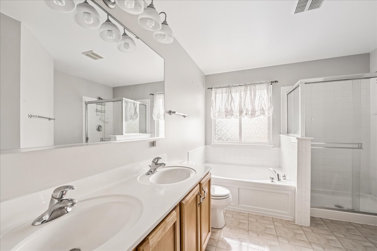 311 Market Street Genoa, IL 60135 - Photo 13 of 24 a bathroom with a tub sink and mirror