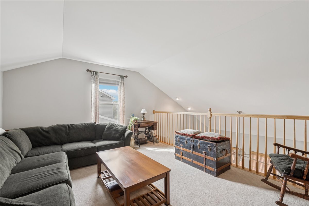 311 Market Street Genoa, IL 60135 - Photo 18 of 24 a living room with furniture and a rug