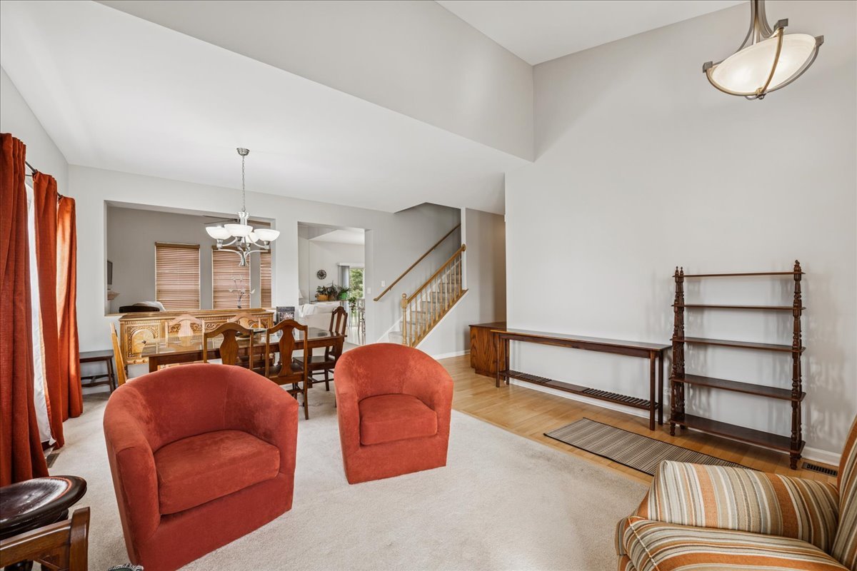 311 Market Street Genoa, IL 60135 - Photo 4 of 24 a living room with furniture ceiling fan and a rug