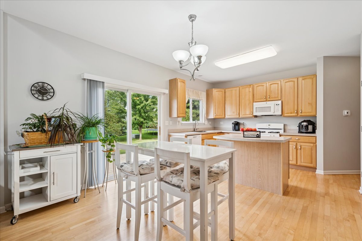 311 Market Street Genoa, IL 60135 - Photo 8 of 24 a view of a dining room with furniture window and wooden floor