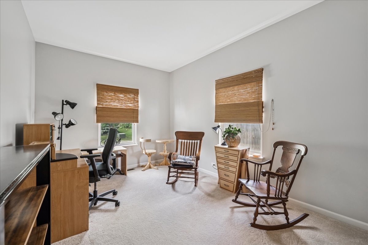 311 Market Street Genoa, IL 60135 - Photo 10 of 24 a view of a workspace with furniture and a window