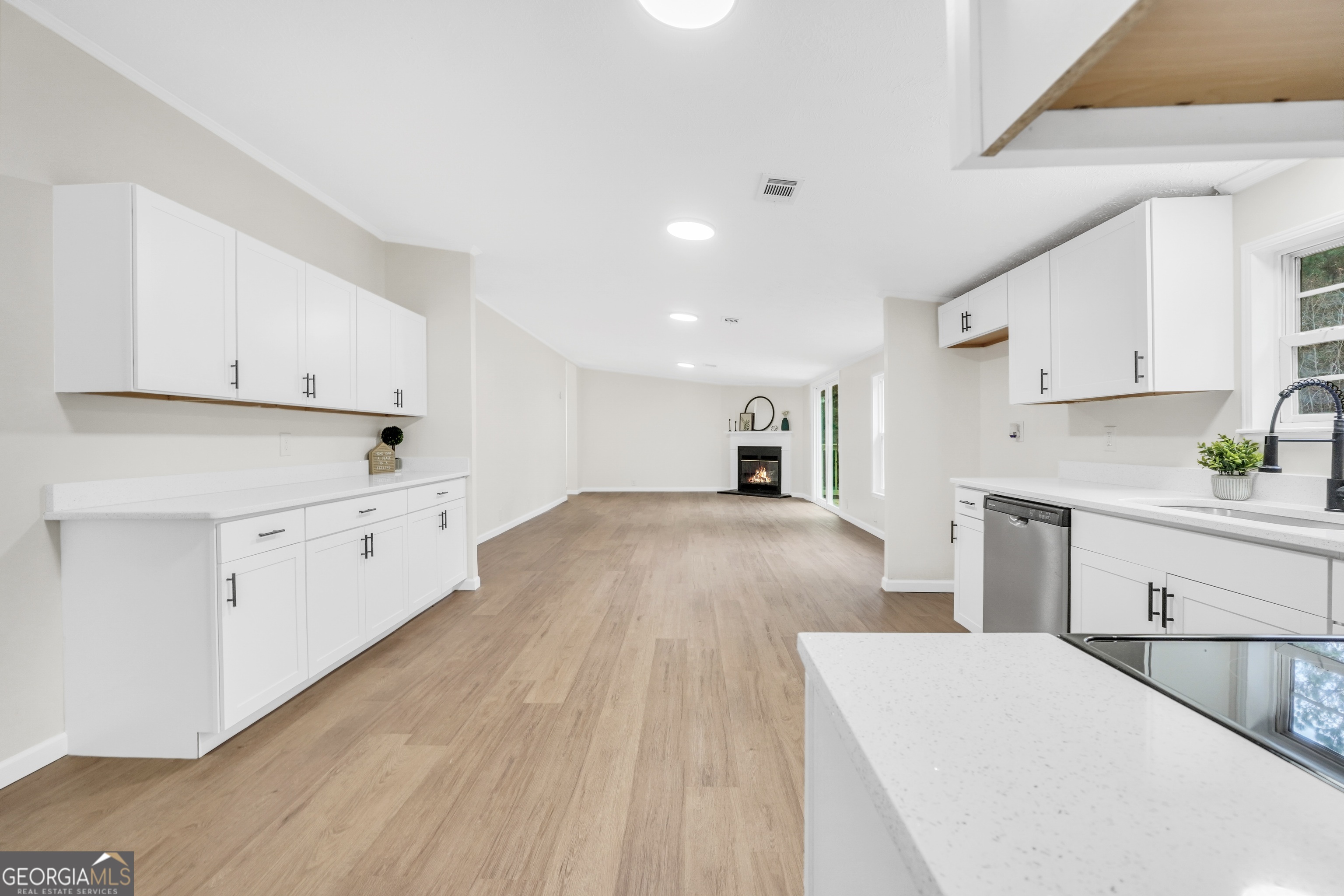 196 Craig Road Forsyth, GA 31029 - Photo 14 of 39 a kitchen with cabinets appliances and a center island