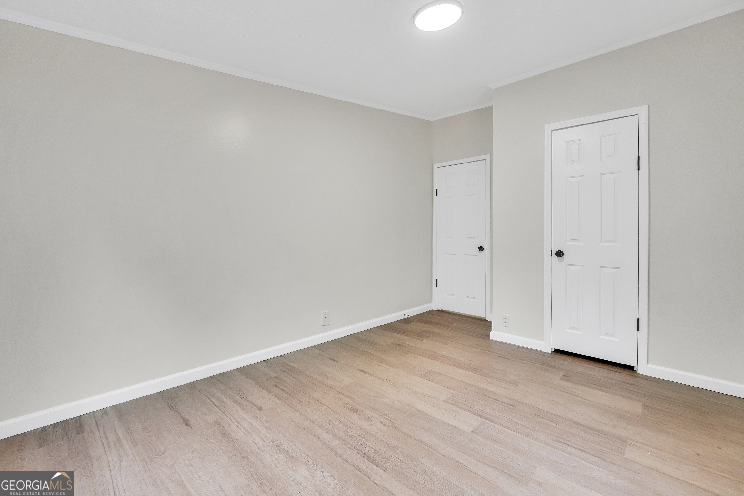 196 Craig Road Forsyth, GA 31029 - Photo 25 of 39 a view of an empty room with wooden floor