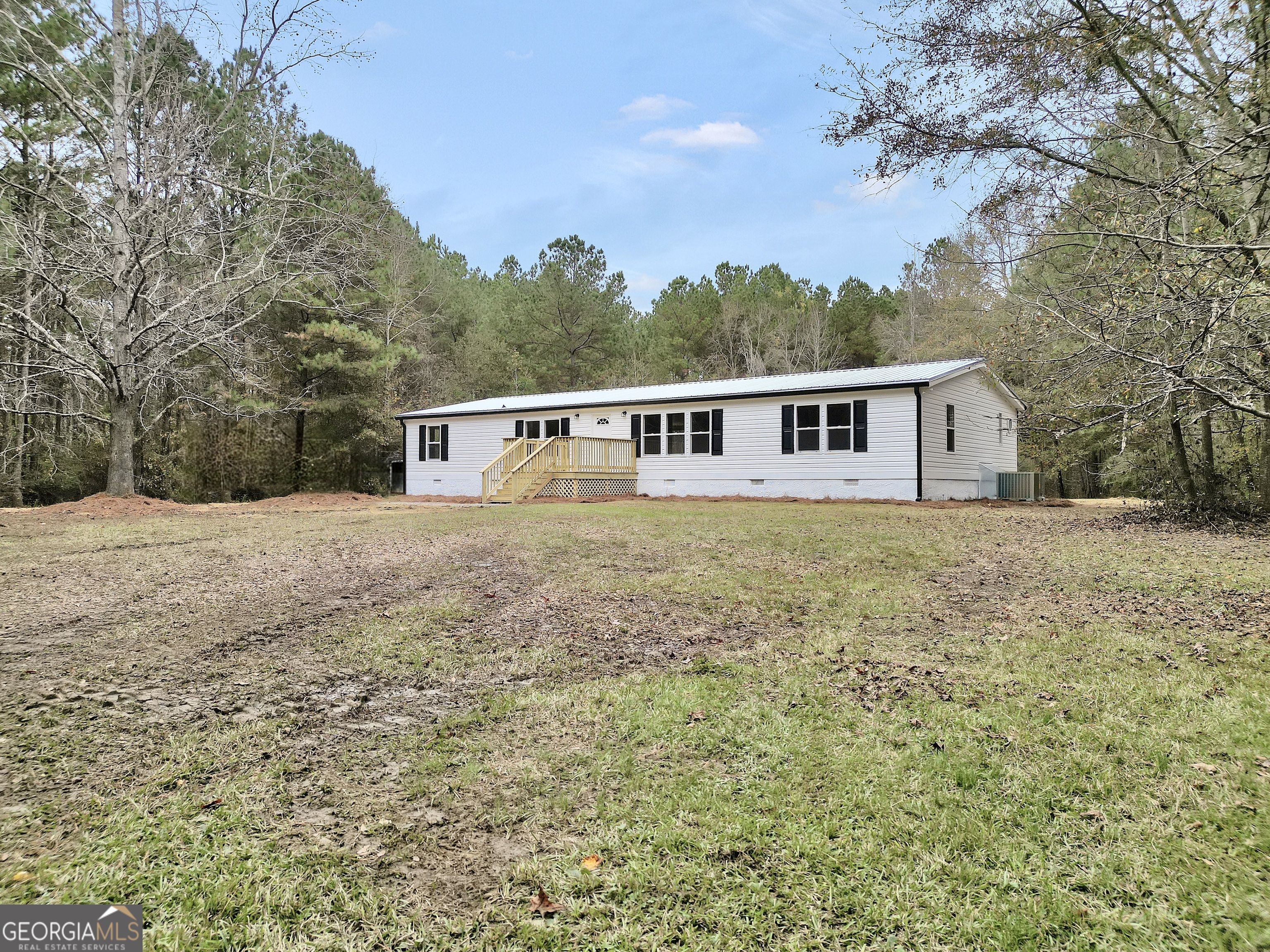 196 Craig Road Forsyth, GA 31029 - Photo 3 of 39 a view of a house with a yard