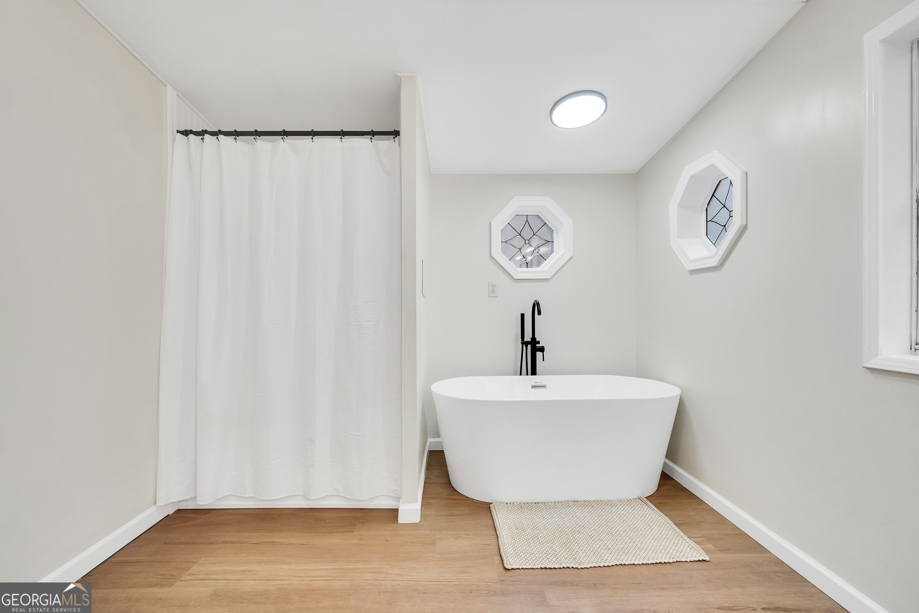 196 Craig Road Forsyth, GA 31029 - Photo 32 of 39 a bathroom with a sink and a mirror
