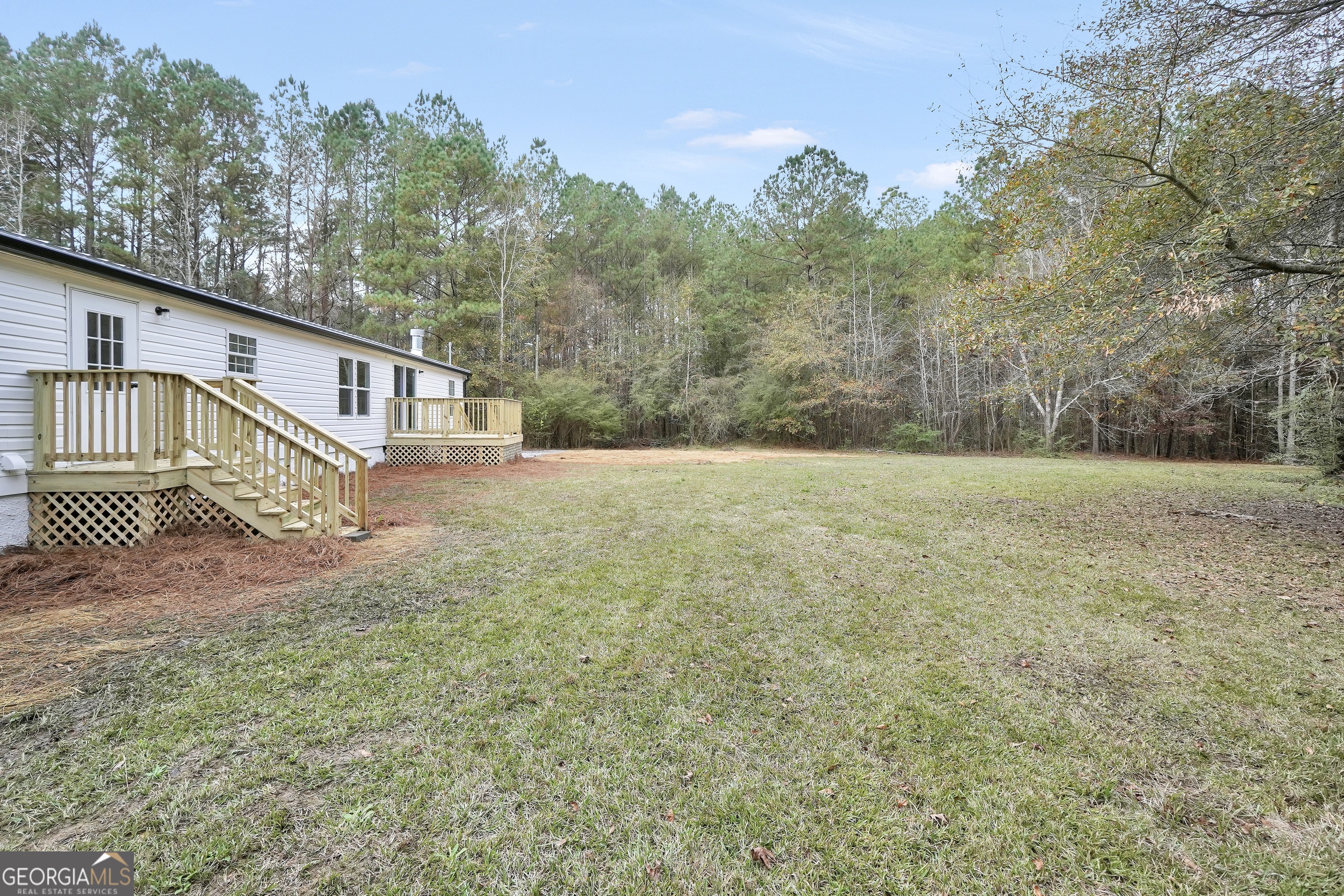 196 Craig Road Forsyth, GA 31029 - Photo 36 of 39 a backyard of a house with lots of green space