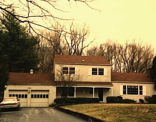49 Marion Road Westport, CT 06880 - Photo 1 of 1 a front view of residential houses with yard