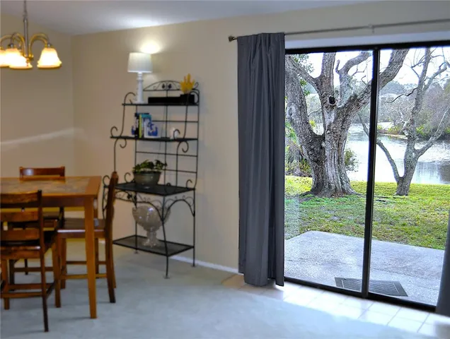 a workspace with furniture and a floor to ceiling window