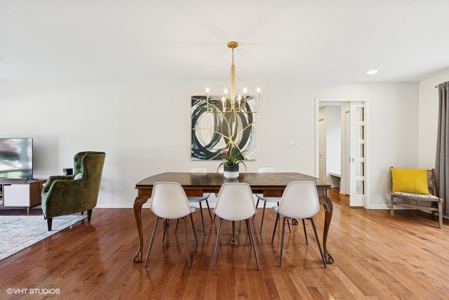 527 Maple Lane Geneva, IL 60134 - Photo 17 of 42 a view of a dining room with furniture and wooden floor