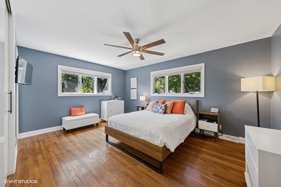 527 Maple Lane Geneva, IL 60134 - Photo 25 of 42 a bedroom with a bed and wooden floor