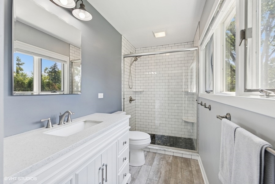527 Maple Lane Geneva, IL 60134 - Photo 28 of 42 a bathroom with a sink a toilet and shower