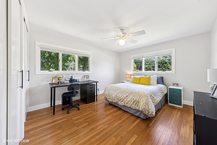 527 Maple Lane Geneva, IL 60134 - Photo 29 of 42 a bedroom with a bed and a table in it
