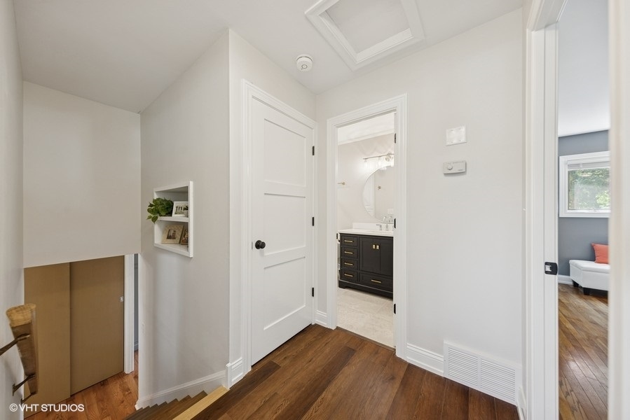 527 Maple Lane Geneva, IL 60134 - Photo 33 of 42 wooden floor with white cabinet