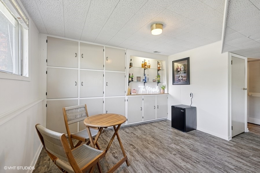 527 Maple Lane Geneva, IL 60134 - Photo 36 of 42 a view of a dining room with furniture and wooden floor