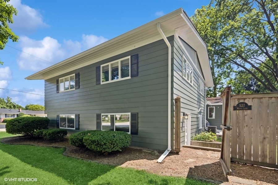527 Maple Lane Geneva, IL 60134 - Photo 4 of 42 a front view of a house with garden