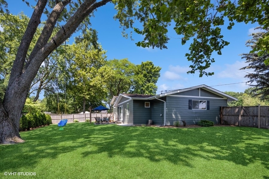 527 Maple Lane Geneva, IL 60134 - Photo 8 of 42 a front view of a house with a garden