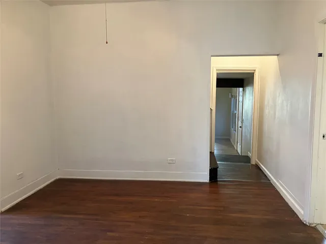 a view of a small space with wooden floor