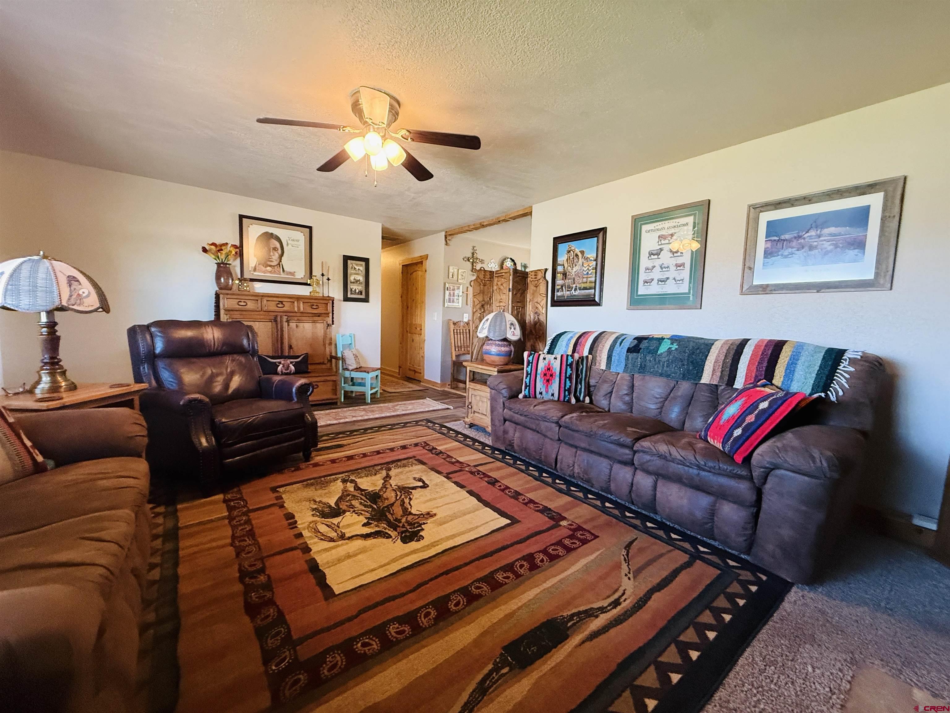 22680 E Road Delta, CO 81416 - Photo 12 of 31 a living room with furniture and a couch